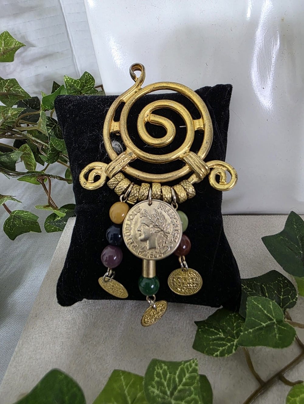 Swirled Gold Tone Brooch with Dangling Beads and Coin Charms